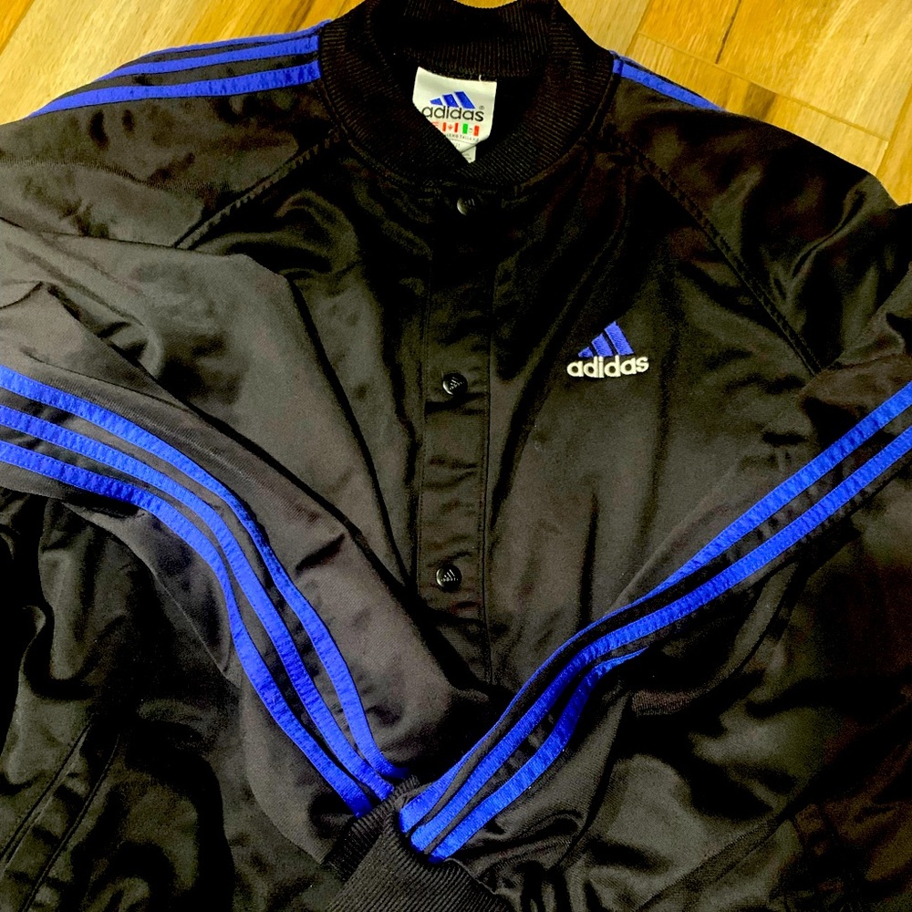 Adidas black button down light weight jacket with blue stripes. Size xl